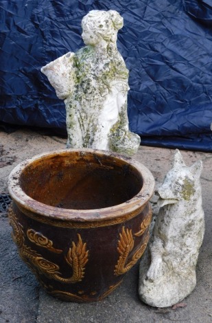 A group of garden ornaments, comprising a cast concrete figure of a maiden carrying water vessel, 70cm high, figure of a seated dog, 23 high, and a brown glazed dragon finish planter, 31cm diameter.