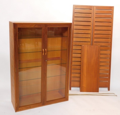 A quantity of Ladderax style teak furniture, comprising wooden shelves, and a two door display cabinet with five glass shelves, the cabinet 131cm high, 89cm wide, 35cm deep, the end panels, 163cm high, 38cm wide, the shelf 87cm wide, 36cm deep, with four 