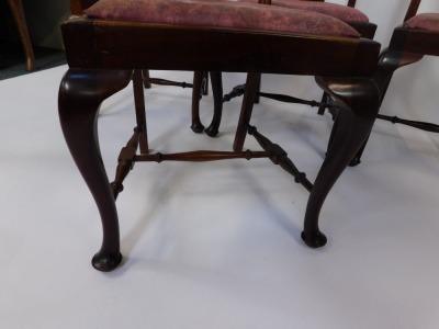 A set of four early 20thC mahogany dining chairs, each with a vase shaped splat and a moulded top, with drop in pink upholstered seats, on cabriole legs, 102cm high, 50cm wide, 42cm deep. - 4