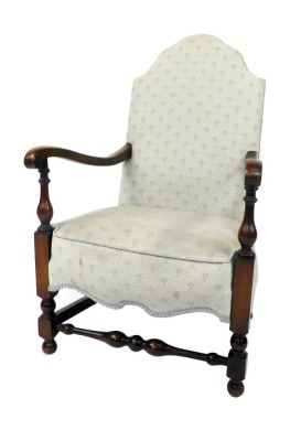 A 1920's/1930's beech child's armchair, with shield back with padded seat, with cream and shield detailing, on cabriole legs and pad feet, 100cm high, 58cm wide, 54cm deep.