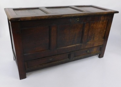 An 18thC oak mule chest, the three panelled top and front above two drawers on stiles, 75cm high, 131cm wide, 47cm deep. - 2