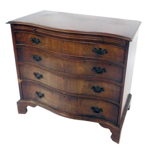 A mahogany serpentine bachelors chest, the shaped front above a brushing slide, and four deep drawers, on bracket feet, cm high, 84cm wide, 46cm deep.