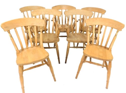 Seven beech kitchen chairs, comprising a set of five carvers, each with splat backs on H stretchers, and a matched paid of single chairs, all stamped Etak R1ahc Slovenia.