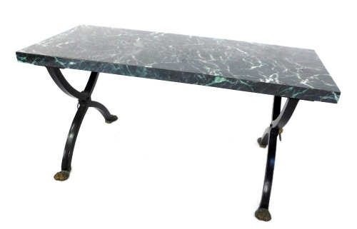 A 20thC coffee table, the marble effect rectangular top on X frame cast metals supports, with lion masks and claw feet, 46cm high, 92cm wide, 39cm deep.