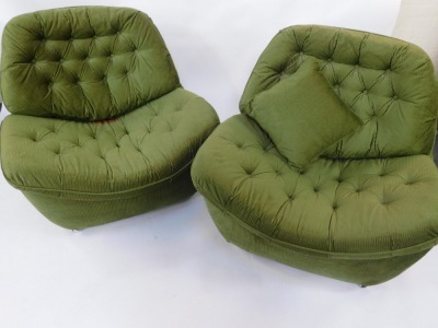 A pair of retro egg shaped chairs, in green cord material, with cushion back and seat, on castors, 89cm high, 94cm wide, 80cm deep. The upholstery in this lot does not comply with the 1988 (Fire & Fire Furnishing) Regulations, unless sold to a known expor - 2