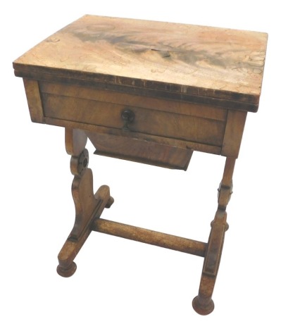 A William IV mahogany work table, the fold over top above a single drawer, with pull out sewing box drawer, on shaped end support and bun feet, with castors, 72cm high, 51cm wide, 38cm deep. (AF)