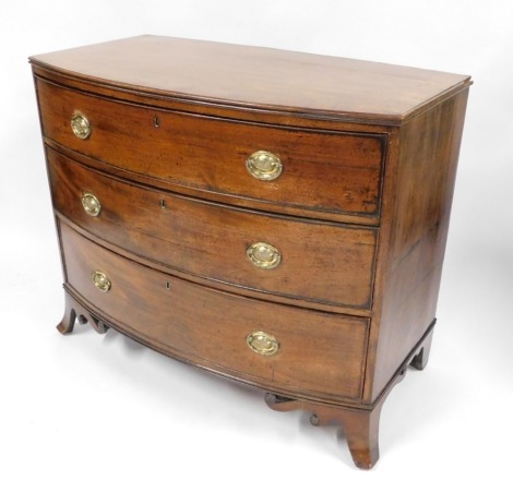 A George III mahogany bow front chest, of three long drawers, with brass acorn back plate, on out splayed legs, 90cm high, 103cm wide, 52cm deep.