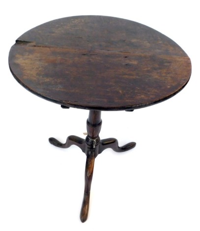 A 19thC oak tripod table, the circular top on a turned column and tripod base, 70cm high, 56cm diameter.