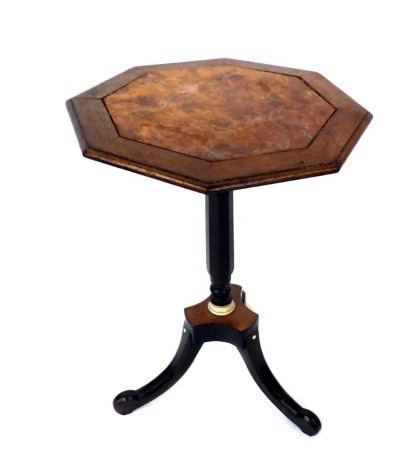 A Victorian walnut and ivory table, the octagonal top with central panel, on a part turned tripod base, 54cm high, 40cm diameter.