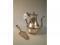 A white metal baluster tea pot