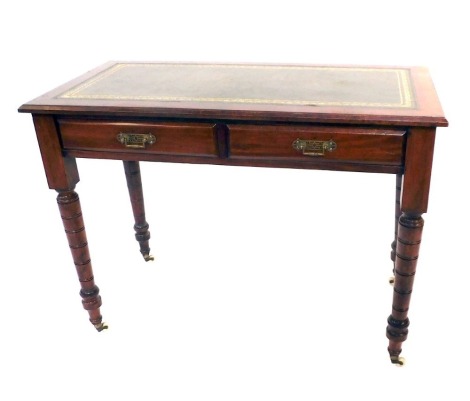 A 19thC mahogany writing table, the top with green leather inset above two drawers, with brass escutcheons, on turned legs, terminating in castors, 76cm high, 103cm wide, 54cm deep.