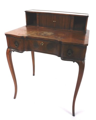 A yew bonheur du jour, top with tambour doors and knop handles, with two cupboard sections, with three frieze drawers, on cabriole legs, 91cm high, 70cm wide, 50cm deep. (AF)