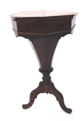 A 19thC mahogany sewing table, with octagonal inlaid top, and trumpet shaped centre, with brass lock plate, on tripod base, 78cm high, 43cm diameter.