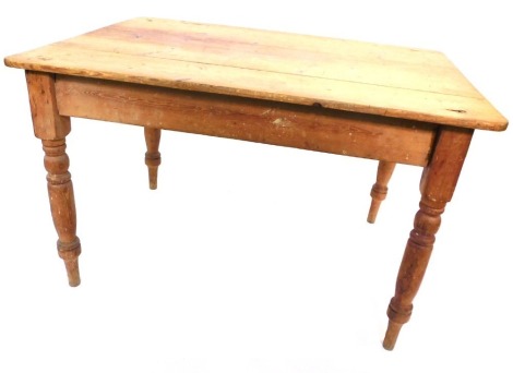 A 19thC pine rectangular kitchen table, the planked top above a drawer, on turned legs, 71cm high, 120cm wide, 88cm deep.