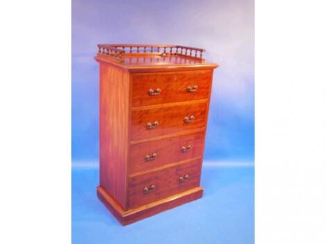 A Victorian mahogany chest of four drawers with brass handles