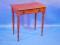 A Victorian mahogany side table with moulded top over frieze drawer with