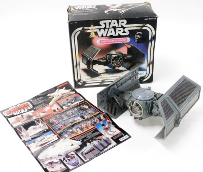 A group of Star Wars boxed toys; Battle Damaged X-Wing Fighter, Rebel Armor Snowspeeder and Darth Vader The Fighter. (3) - 4