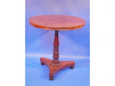 An early 19th century mahogany occasional table on gadrooned baluster column