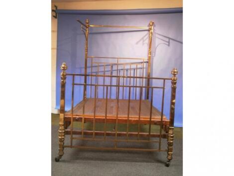 A early 20thC brass and wrought iron half tester bed