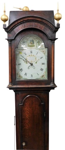 A Georgian oak cased long cased clock by J Marshall of Chumleigh, the enamel break arch dial painted with a peacock and flowers, chapter ring bearing Roman numerals, date aperture, chain wound with bell strike, the case hood with gilt ball finials, cylind
