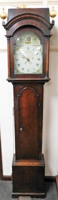 A Georgian oak cased long cased clock by J Marshall of Chumleigh, the enamel break arch dial painted with a peacock and flowers, chapter ring bearing Roman numerals, date aperture, chain wound with bell strike, the case hood with gilt ball finials, cylind - 2