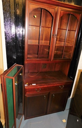 A tabletop display cabinet, 107cm wide, and a narrow dresser, 186cm high. Buyer Note: WARNING! This lot contains untested or unsafe electrical items. It is supplied for scrap or reconditioning only. TRADE ONLY