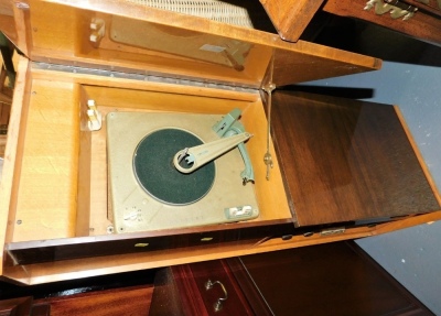 A mid 20thC Phillips stereo teak cased radiogram, lacking legs, 110cm wide. Buyer Note: WARNING! This lot contains untested or unsafe electrical items. It is supplied for scrap or reconditioning only. TRADE ONLY - 2