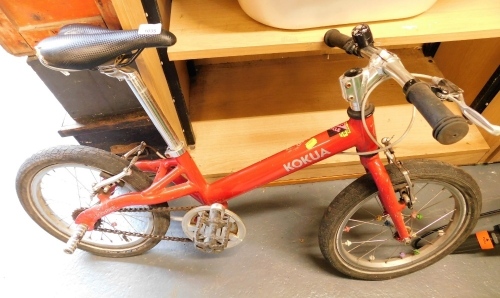 A Kokua child's bicycle, in red.