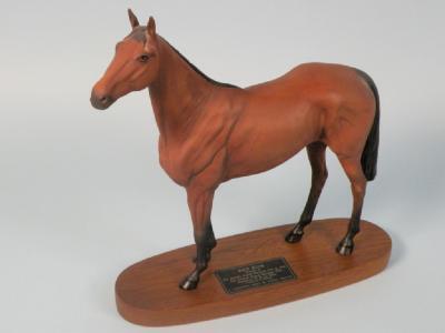 A Beswick connoisseur model of Red Rum on a mahogany base