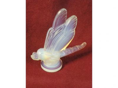 A Sabino opalescent glass paperweight in the form of a dragonfly