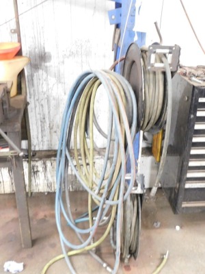 Two air hose reels and further hosing.