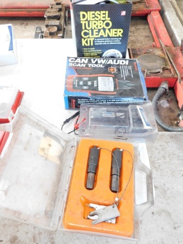 A Motor remote starter scan tool, diesel turbo cleaner kit and drill sharpening machine.