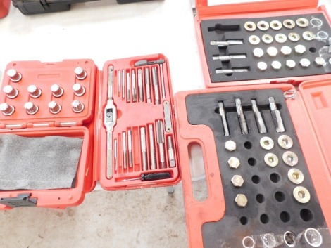 A spline wheel bolt set, tap and dIe set, drain plug tread repair kit and sump plug red repair kit. (4)