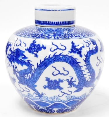 A 19thC Chinese porcelain ginger jar and cover, decorated in underglaze blue with a band of scrolls, peonies above clouds, flowers and four toed dragons, four character Yongzheng mark, 22.5cm high, 22.5cm wide. - 2