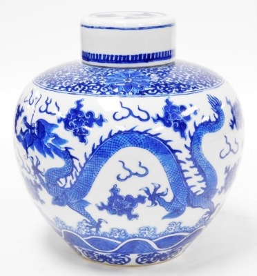 A 19thC Chinese porcelain ginger jar and cover, decorated in underglaze blue with a band of scrolls, peonies above clouds, flowers and four toed dragons, four character Yongzheng mark, 22.5cm high, 22.5cm wide. - 4