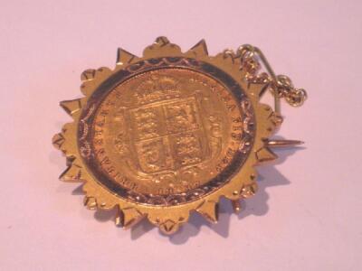 A Victorian half sovereign in a brooch mount 1887