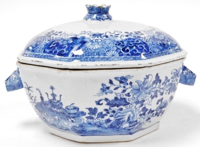 An 18thC Chinese export porcelain octagonal tureen and cover, decorated in underglaze blue with flowers beside a rustic table, the lid with a crown finial, the base with rabbit mask handles, 30cm wide. - 2