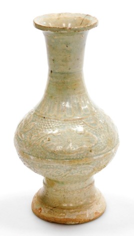 A Ming Longquan celadon vase, of baluster form, decorated with bands of lotus flowers and scrolling leaves against a dotted ground, 20cm high.