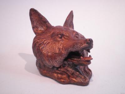 A cold painted bronze inkwell in the form of a fox's head