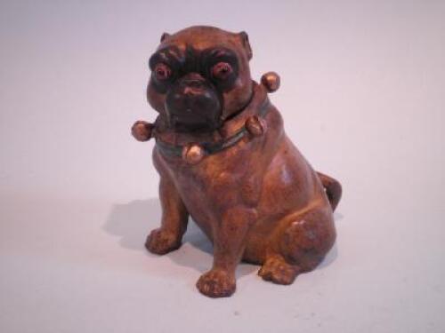 A cold painted bronze inkwell in the form of a Pug dog wearing a green collar with bells