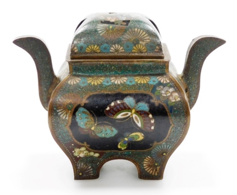 A Japanese Meiji period cloisonne koro and cover, with a central panel depicting a ho-ho bird, the reverse with butterflies, against a mottled green ground decorated with flowers, raised on four feet, 11cm high.