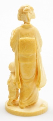 An early 20thC Japanese ivory okimono figure, of a geisha holding fan accompanied by a child, signed Kosshi to base, 16.5cm high. - 9