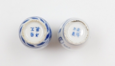 Three Chinese blue and white cylindrical porcelain snuff bottles, decorated with dragons, figures in a landscape, another of meiping form decorated with horses, and two further miniature blue and white vases; various Yongzheng and Qianlong marks to the un - 7