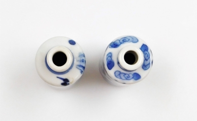 Three Chinese blue and white cylindrical porcelain snuff bottles, decorated with dragons, figures in a landscape, another of meiping form decorated with horses, and two further miniature blue and white vases; various Yongzheng and Qianlong marks to the un - 13