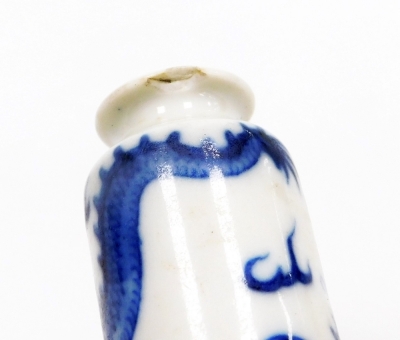 Three Chinese blue and white cylindrical porcelain snuff bottles, decorated with dragons, figures in a landscape, another of meiping form decorated with horses, and two further miniature blue and white vases; various Yongzheng and Qianlong marks to the un - 21