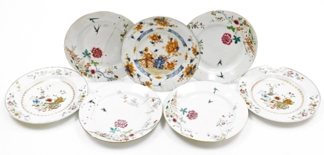 A collection of 18th Chinese plates, including four matching famille rose with chrysanthemum and swallow decoration, 23cm diameter, a pair with flowers and vases, 23cm diameter, and a Chinese Imari plate, 22.8cm diameter. (AF)