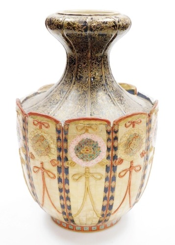 A Meiji period Japanese Satsuma vase, with tapered and inverted flared neck, in black with gilt foliate scroll decoration, the panelled body with intricate rosettes and ribbons, (AF), 42cm high.