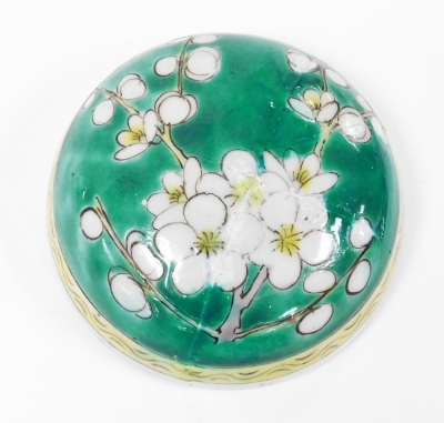 A 19th/ 20thC Chinese porcelain green enamelled ginger jar and cover, decorated with birds and prunus blossom, with hatched and reserved floral border, four Kangxi character mark, 19.5cm high. (AF) - 7