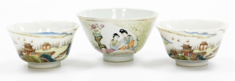 A Chinese Republic porcelain tea bowl, of tapering circular form, on circular foot, enamelled with figures beside a vase of flowers on stand, predominantly in purple, yellow and green, 6cm high, two further Republic porcelain tea bowls enamelled with ship