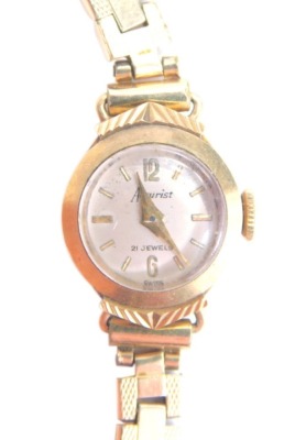 A 20thC ladies cocktail watch, in 9ct gold case, 1cm face, with fancy link strap, marked rolled gold, baton pointers and numerals, 11.5g all in.